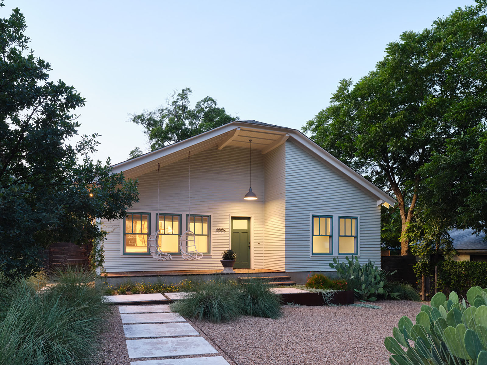 Front view of the New York Residence in Austin, TX – a modern craftsman-style home designed by Elizabeth Baird Architecture and built by Texas Construction Company with drought-tolerant landscaping and custom exterior finishes