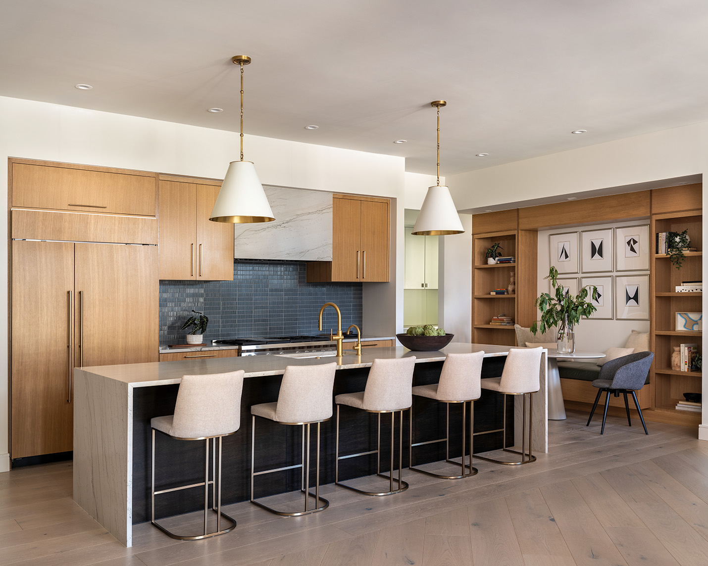 House Renovation & Addition in Austin, TX - Kitchen with long island and stools.