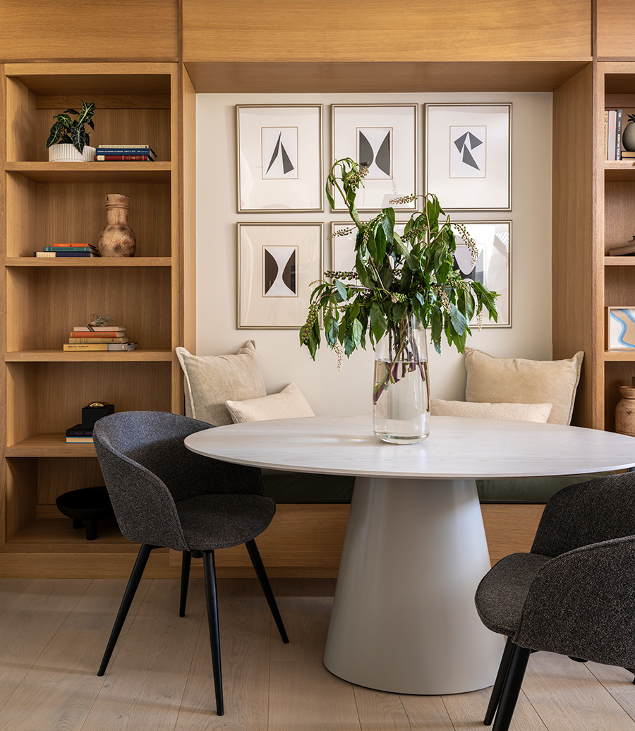 House Renovation & Addition in Austin, TX - Dining room with custom wood shelving.