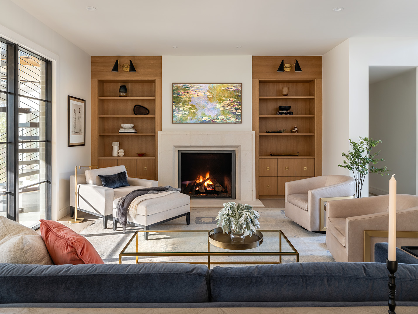 House Renovation & Addition in Austin, TX - Living room with custom built in wood shelves.