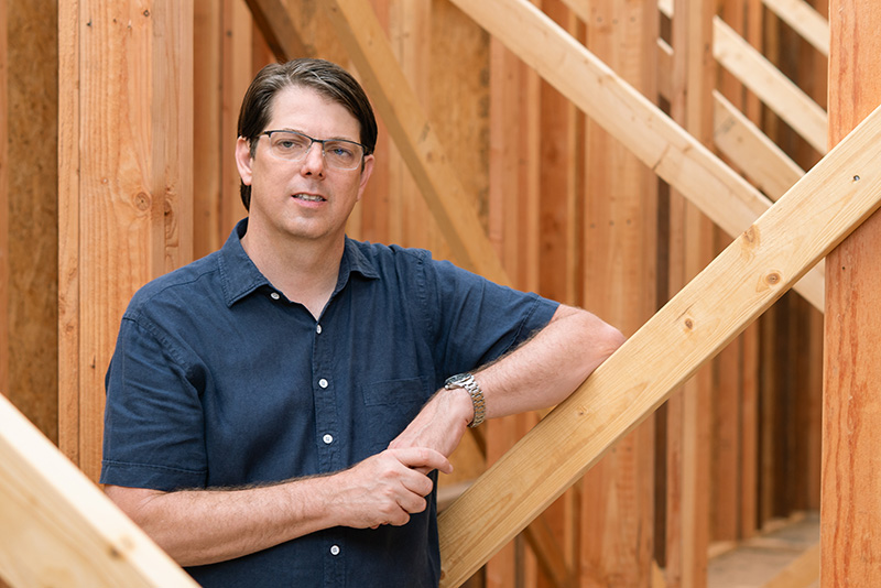 Royce Flournoy, president of Texas Construction Company, standing at a luxury home construction site in Austin, Texas