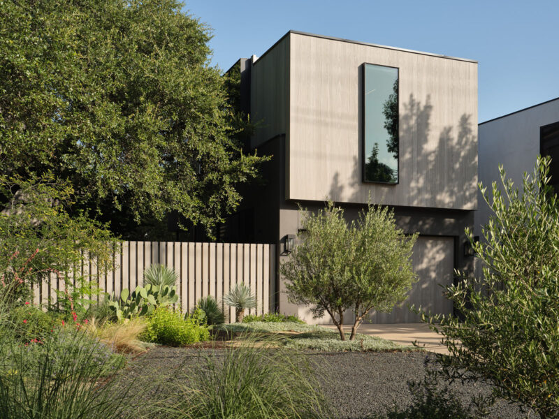 Contemporary house addition in Austin, TX featuring wood-paneled exterior and minimalist design, completed by Texas Construction Company in collaboration with FAB Architecture.